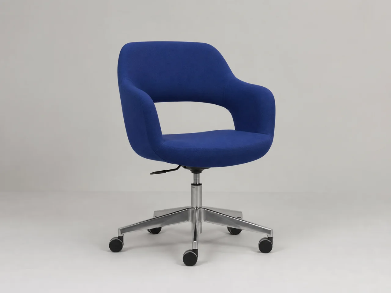 Before: A cobalt chair moved from a plain studio into a colorful campaign set